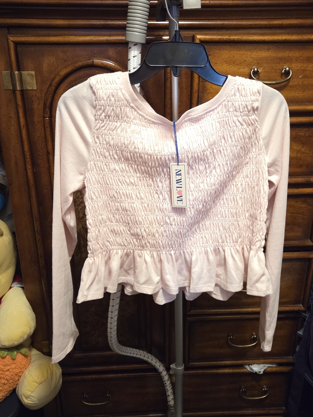Smocked Ruffle Hem Long-Sleeve Crop Top in Light Pink